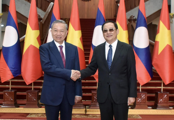 President To Lam meets Lao Prime Minister -0