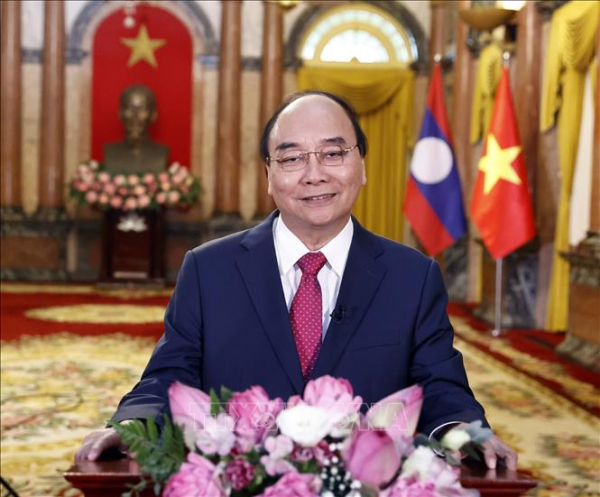 Chủ tịch Nước Nguyễn Xuân Phúc: Mối quan hệ Việt Nam - Lào sẽ tiếp tục nở hoa thơm, kết trái ngọt -0
